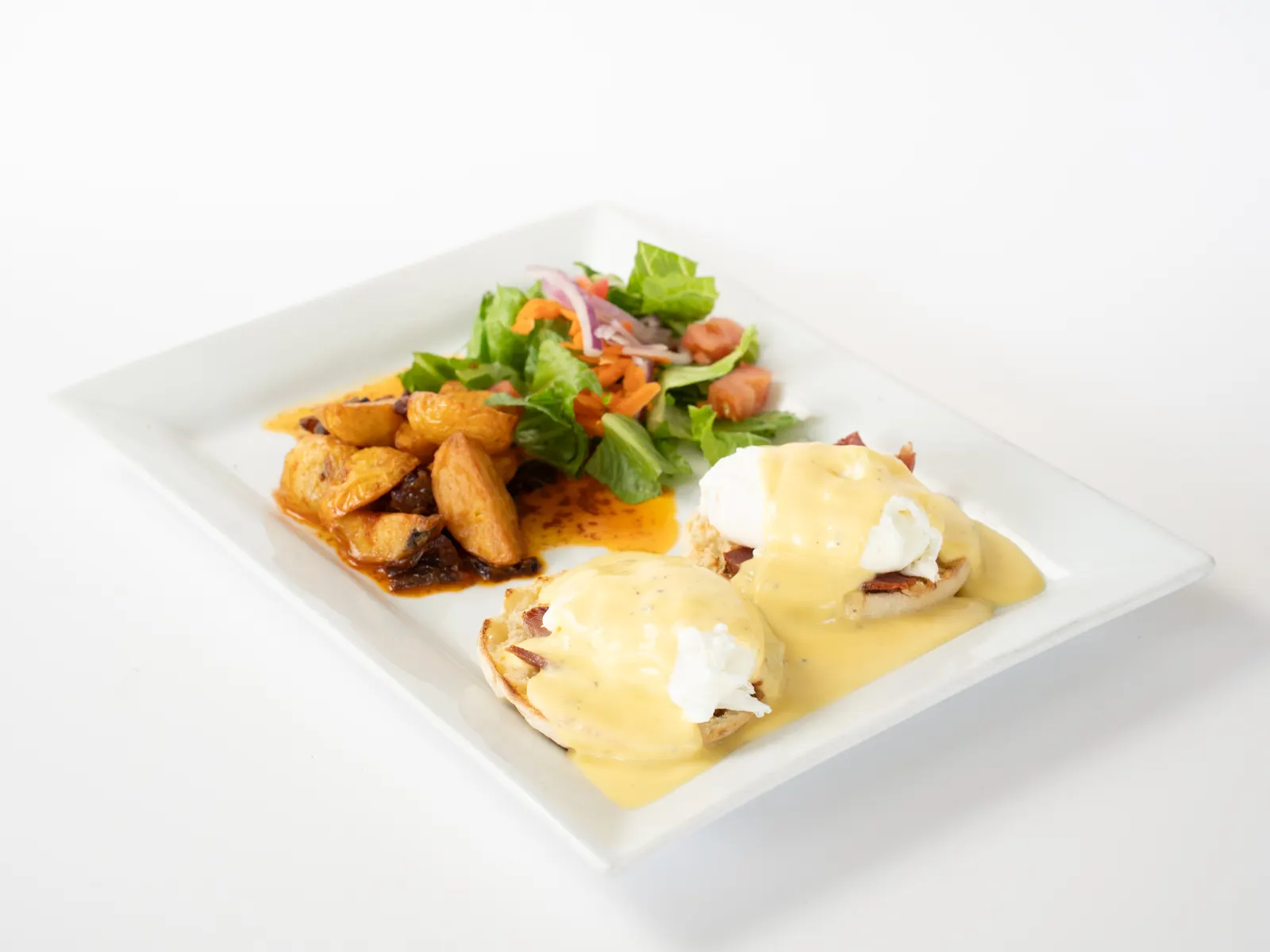 Pulcinella Benedict: poached eggs with hollandaise and home potatoes